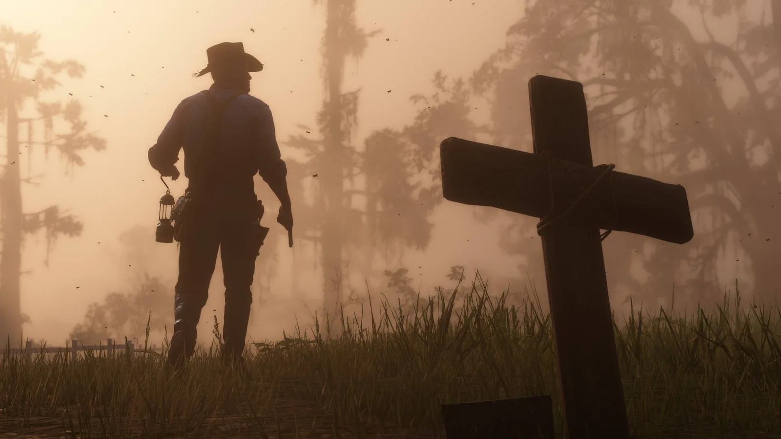 Un vaquero frente a una cruz al atardecer en Red Dead Redemption 2
