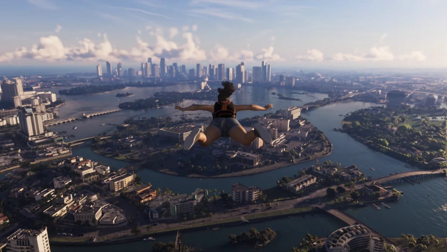 Character skydiving over Vice City, with islands, canals and skyscrapers below